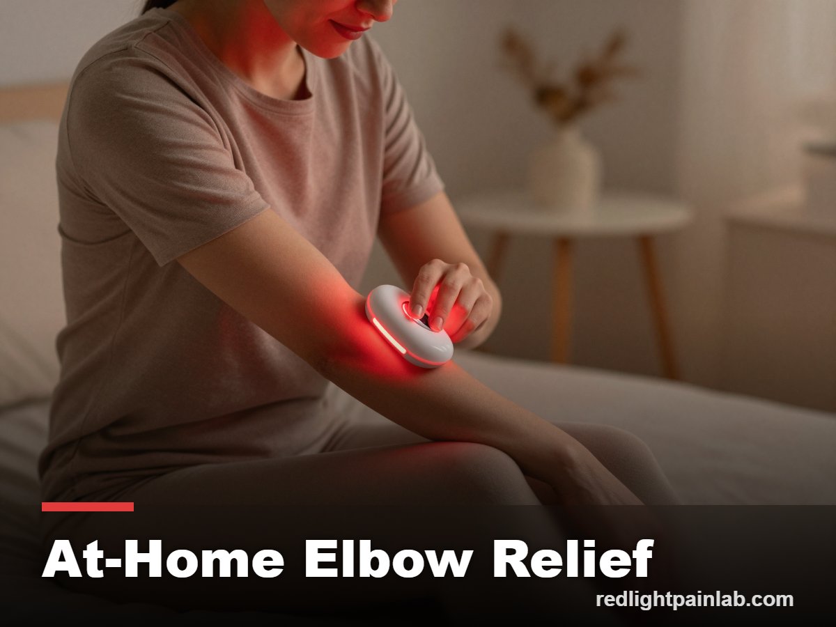 Person using a red light therapy device on the elbow at home