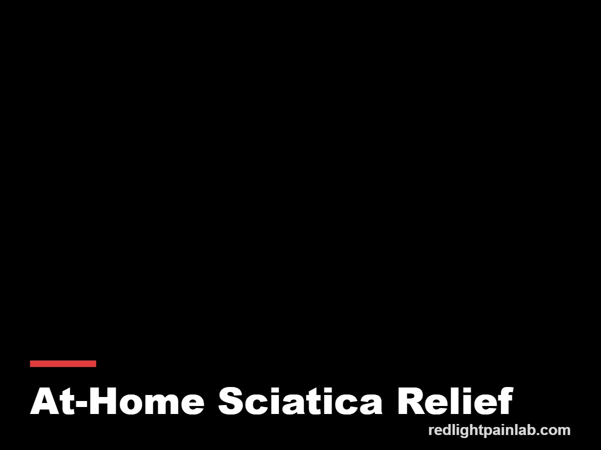 Person using a red light therapy panel on the lower back at home for sciatica